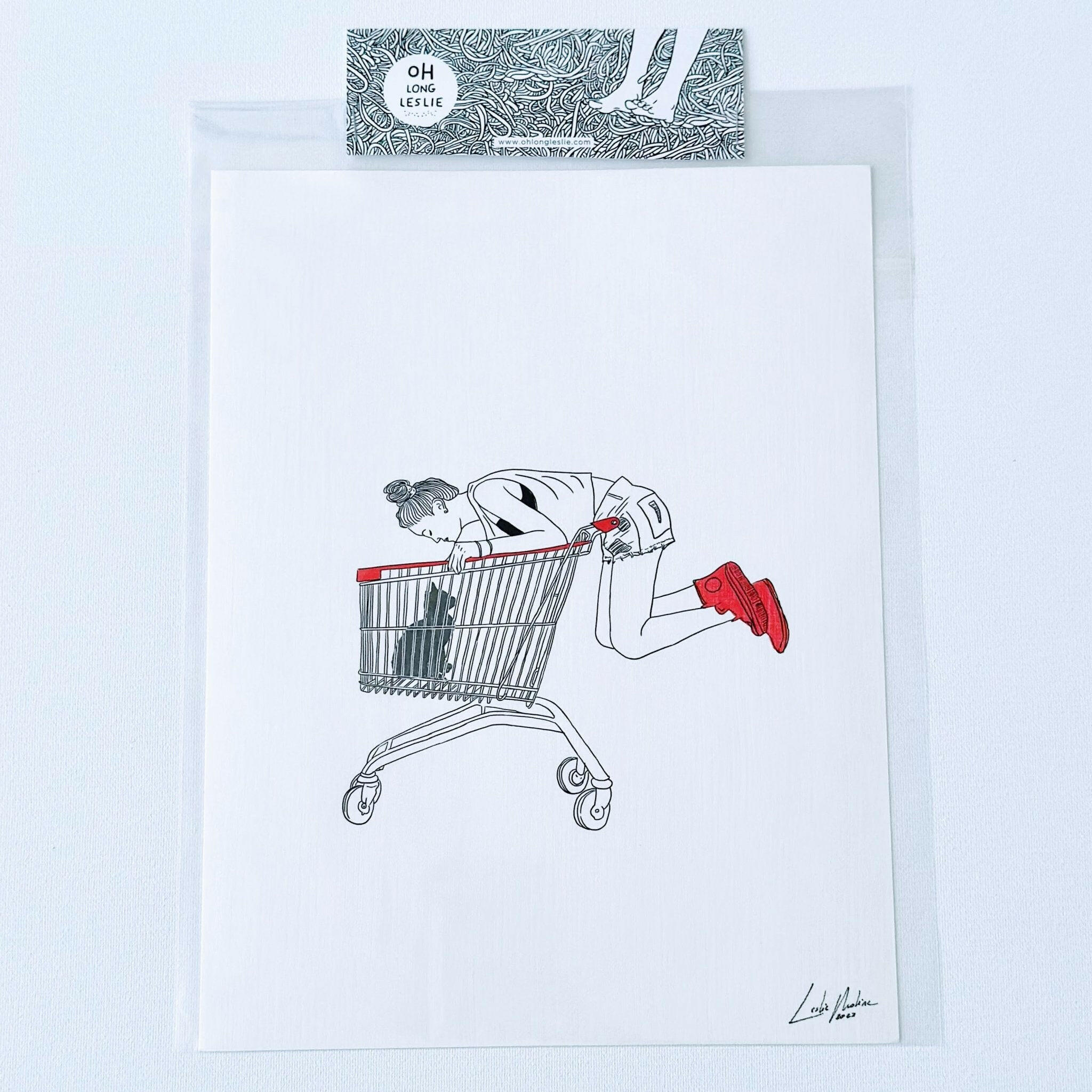 Black Cat in Shopping Cart Art Print by Leslie Molina.