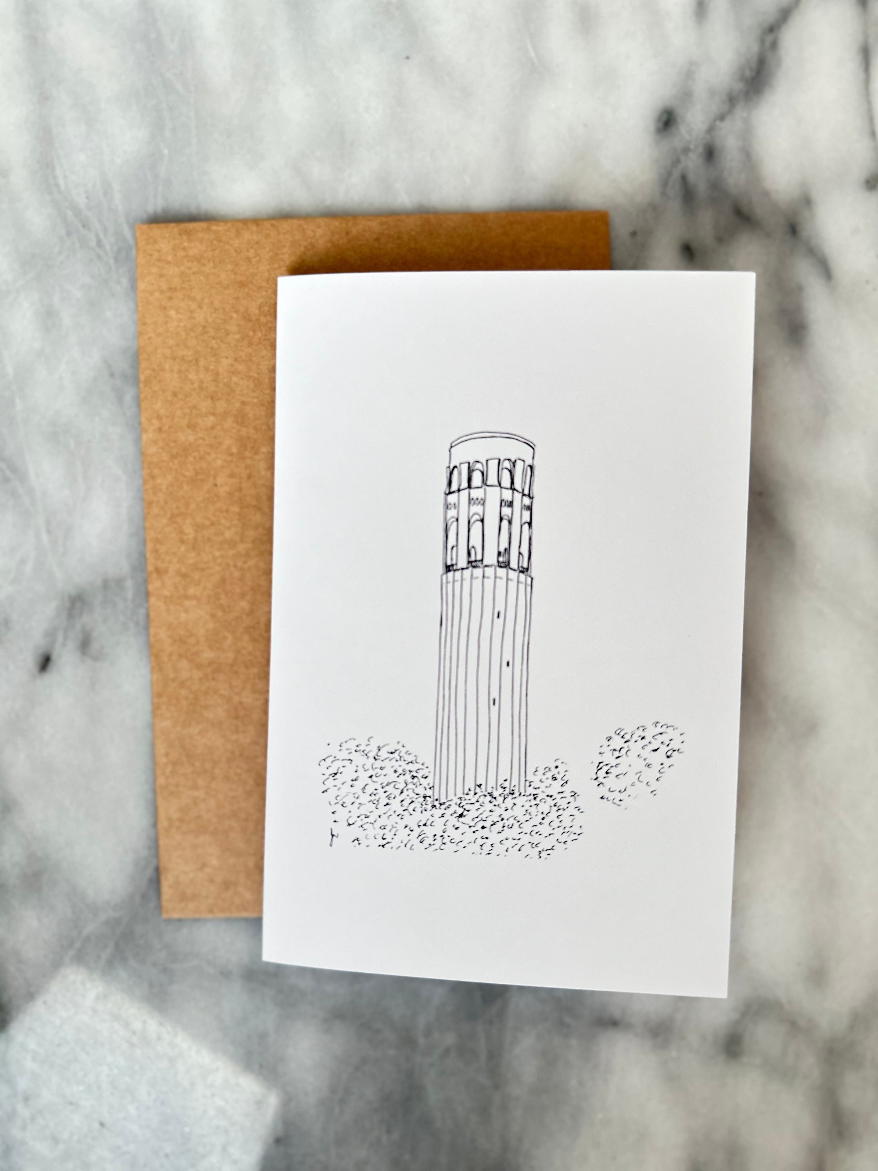 Greeting card with architectural illustration on marble surface