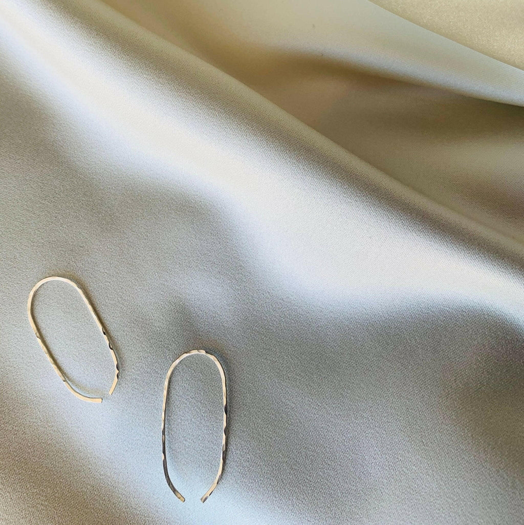 Desert Chic: Handcrafted Hammered Oval Hoop Earrings by Points Jewelry.