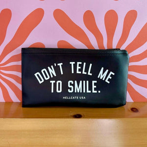 Don't Tell Me To Smile Zipper Clutch.