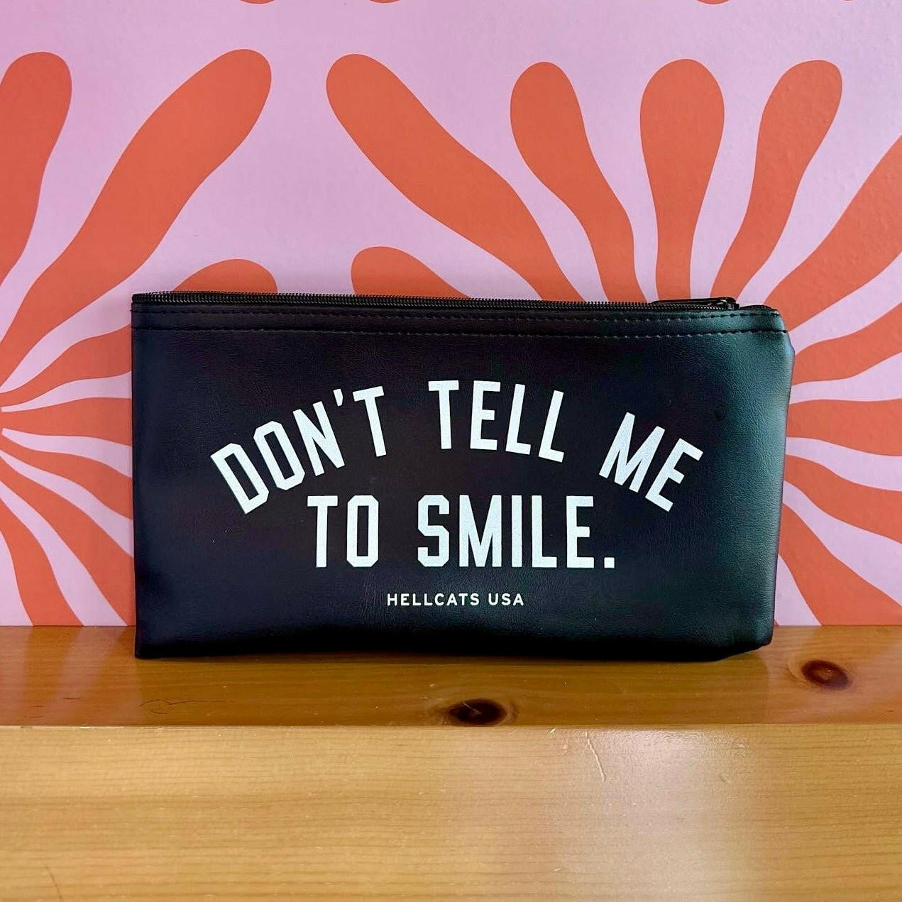 Don't Tell Me To Smile Zipper Clutch.