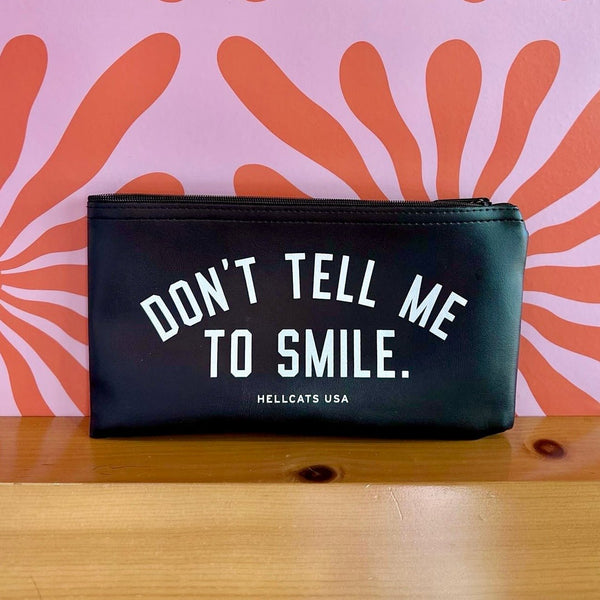 Don't Tell Me To Smile Zipper Clutch.