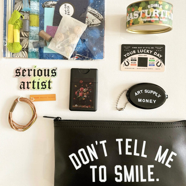 Don't Tell Me To Smile Zipper Clutch.